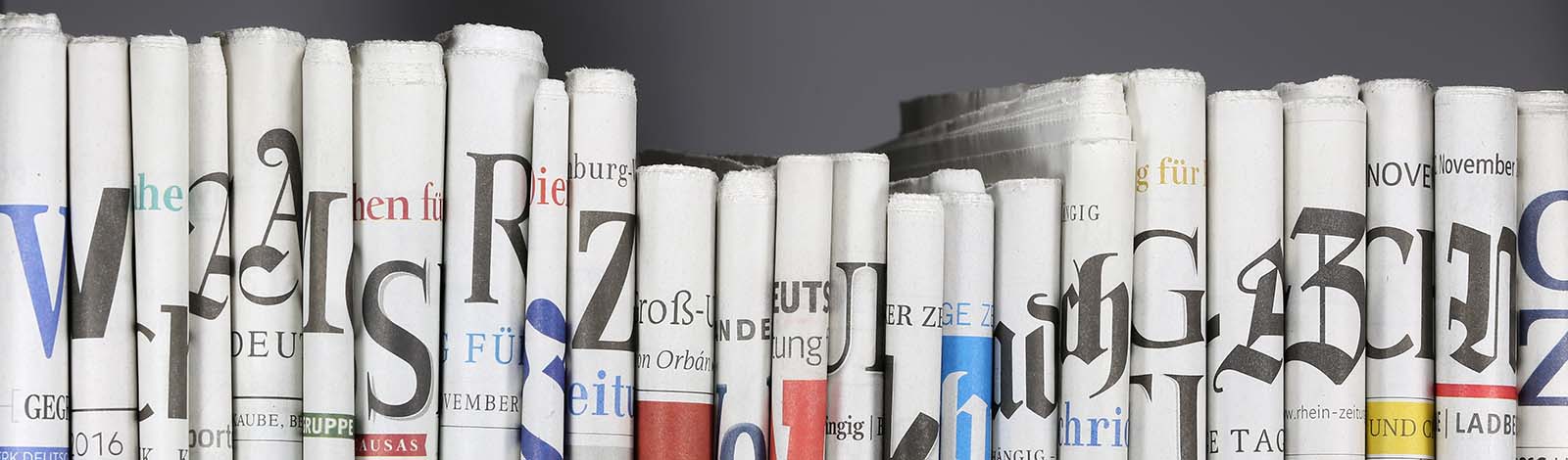 A view of German newspapers, folded, with the spines showing