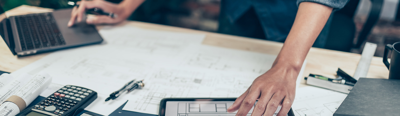 A planning manager at their construction desk